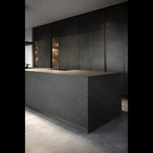 Stylish kitchen with integrated shelving and soft-touch ceramic island in Seta Liquorice tone by Laminam